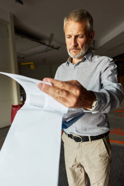 Advisor reviewing documents during business diligence
